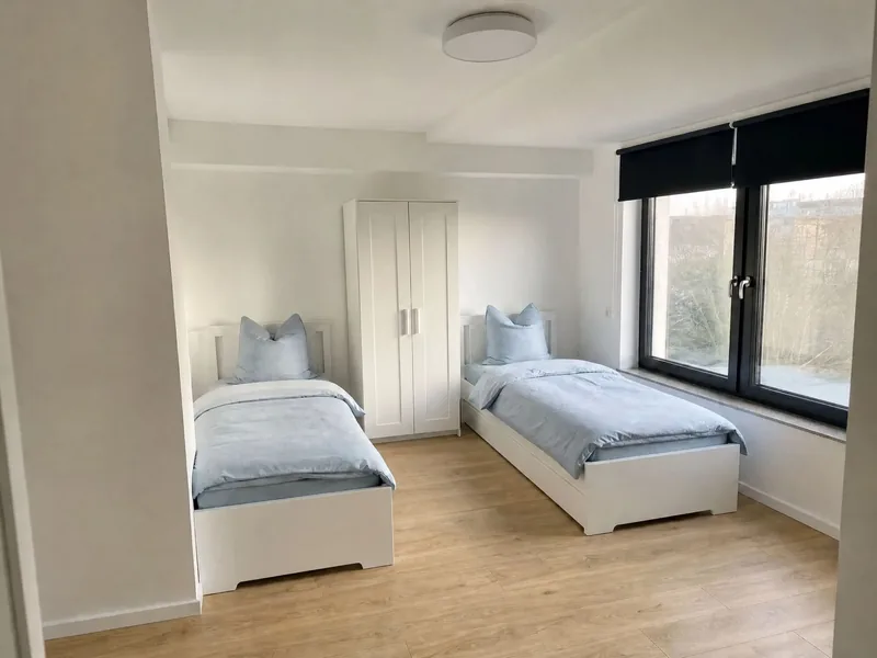 Zweibettzimmer mit zwei getrennten Einzelbetten